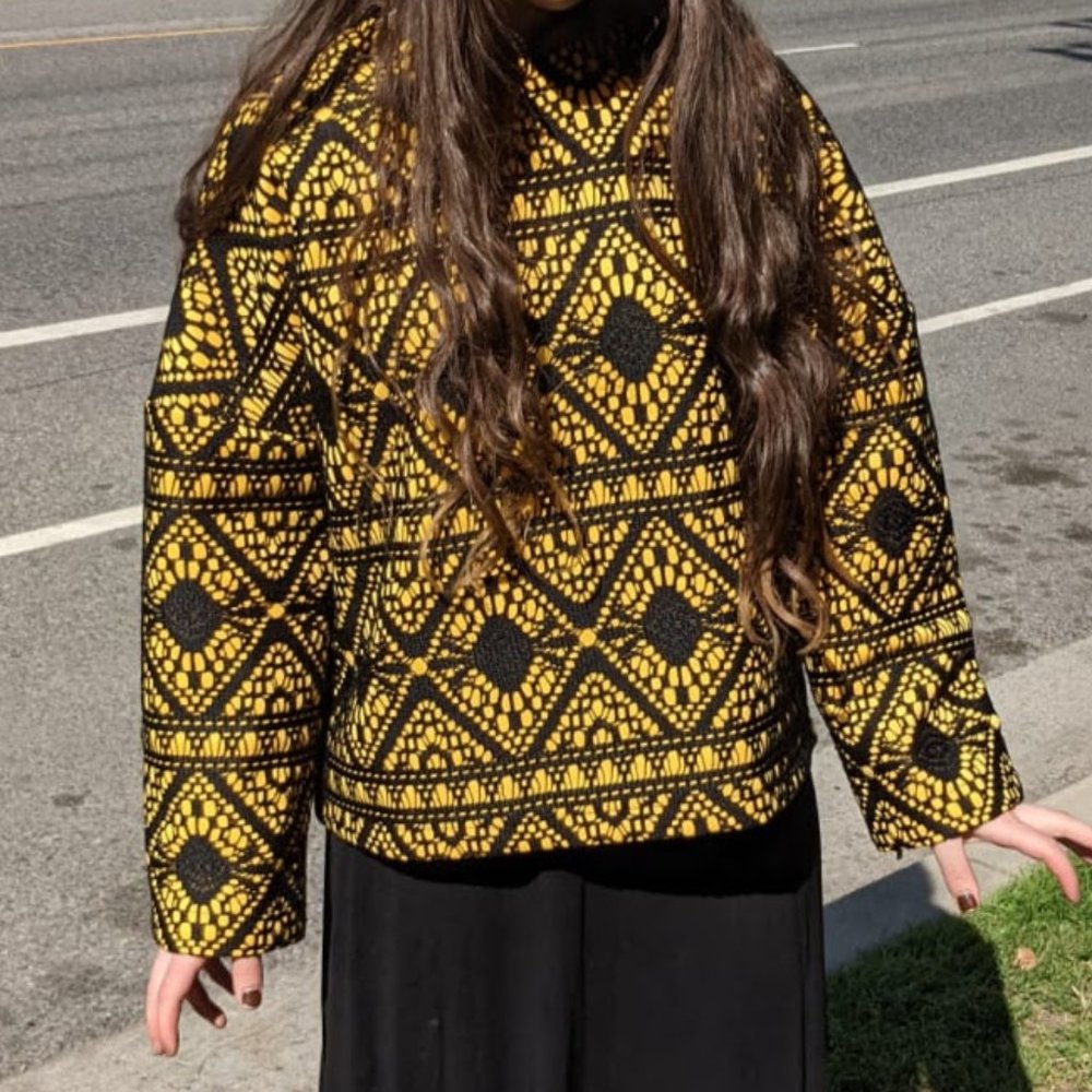 yellow with black patterns crewneck